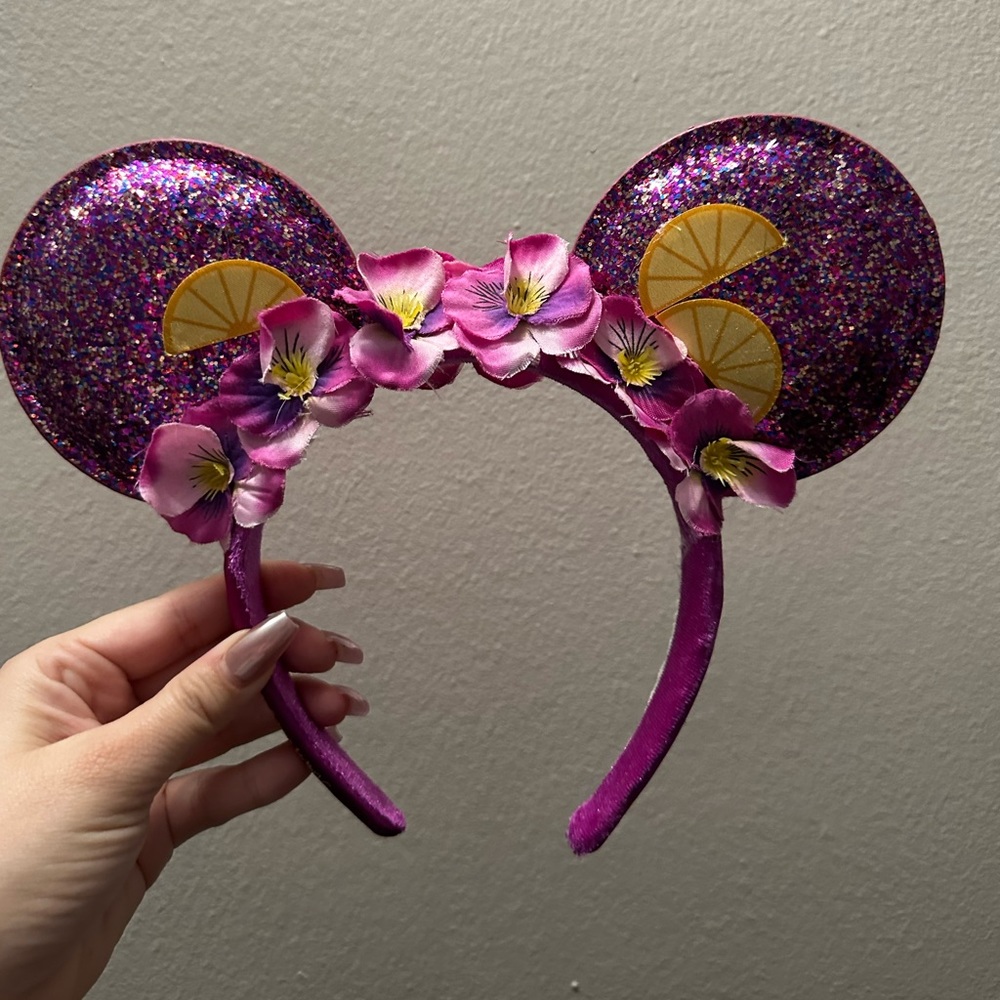 Purple and yellow glitter, flower, and garden ears